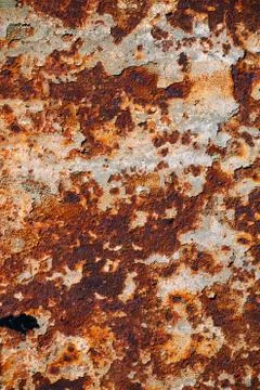 Texture of rusty iron, cracked paint on an old metallic surface, sheet of rus Stock Photos