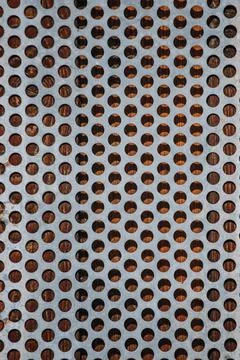 Texture of rusty iron mesh, on a black background Stock Photos