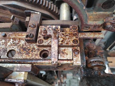 Texture of rusty old mechanism. Old printing press. Museum of book printing.. Stock Photos
