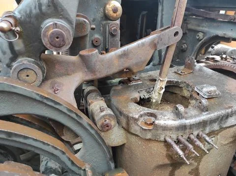 Texture of rusty old mechanism. Old printing press. Museum of book printing.. Stock Photos