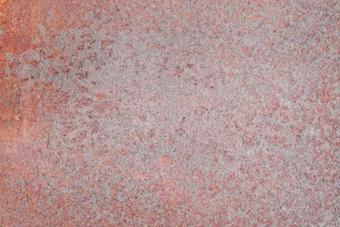 The texture of a rusty red metal surface with fine speckles Stock Photos
