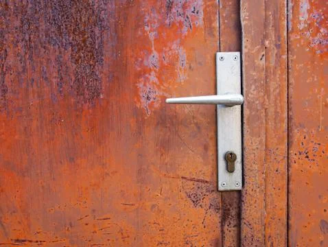 Texture of rusty sheet metal with lock and handle of interesting color Stock Photos