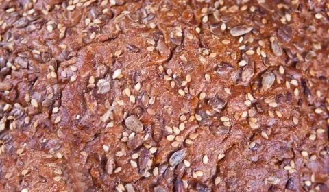Texture of rye bread with cereals and seeds. Stock Photos