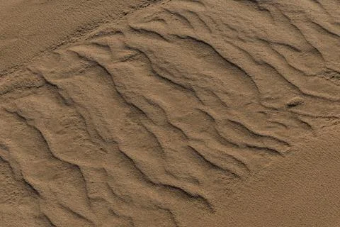 Texture of sand and earth, sand dunes and mountains 库存照片