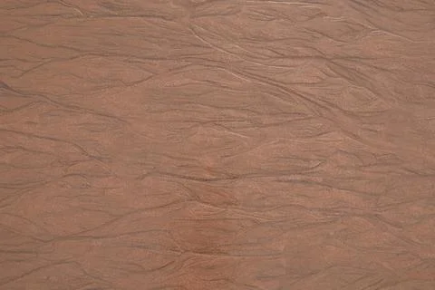 Texture of sand on an ocean beach at low tide Stock Photos