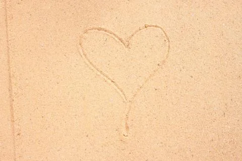 Texture of sand surface with heart Stock Photos