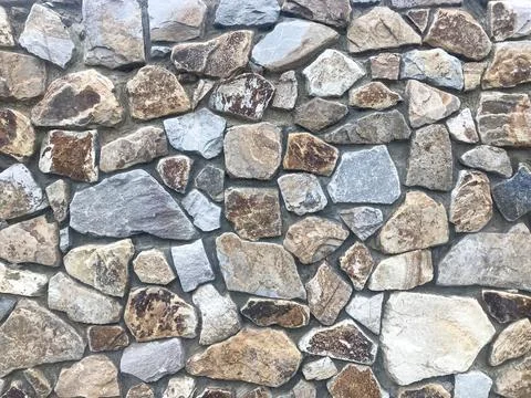 Texture. Savage stone wall Stock Photos