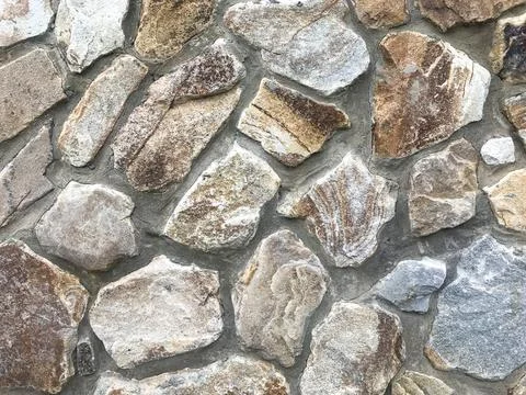 Texture. Savage stone wall Stock Photos