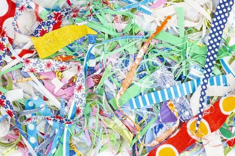 Texture of scraps of colored fabrics as a background or backdrop, home crafts Stock Photos