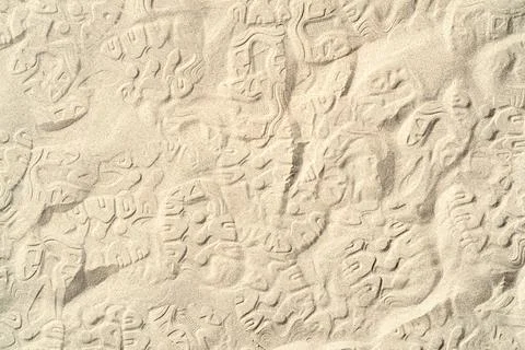 Texture of sea sand background closeup with ornament Stock Photos