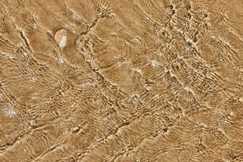 Texture of the seashore with rolling waves 写真素材