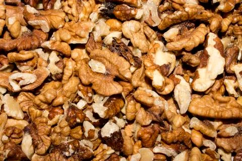 The texture of the shelled walnuts.Background of peeled walnuts. Stock Photos