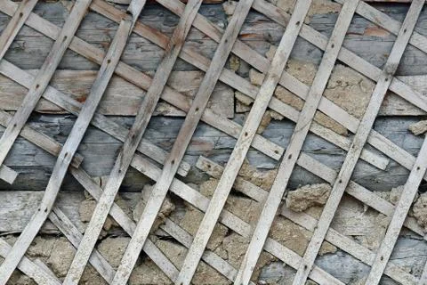 Texture of shingles on a crumbling plastered wall Stock Photos