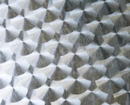 Texture of shining metal table surface with scratches and circular milling Stock Photos