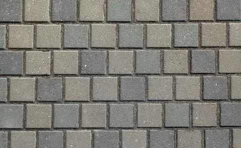 The texture of the sidewalk of the street. Stock Photos