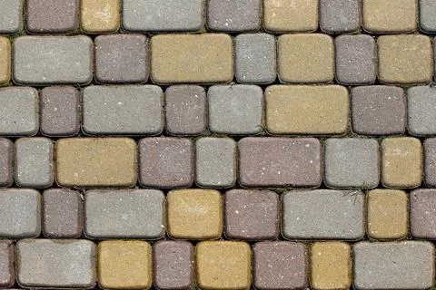 The texture of the sidewalk of the street. Stock Photos