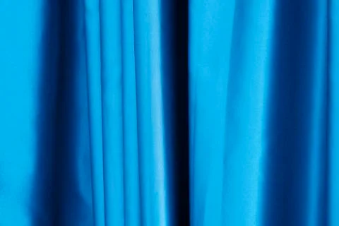 Texture of silky smooth fabric. Background of crimson material. Luxurious blu Stock Photos
