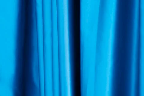 Texture of silky smooth fabric. Background of crimson material. Luxurious blu Stock Photos