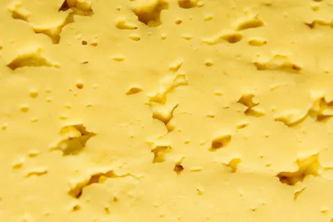 Texture of the sliced cheese for background Stock Photos