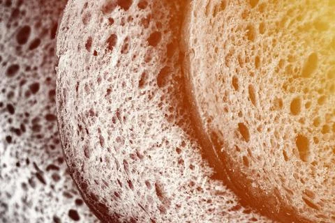 Texture of slices white bread as a close up background. gray backdrop of roug Stock Photos