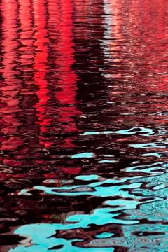The texture of small ripples on the water in two bright colors Stock Photos