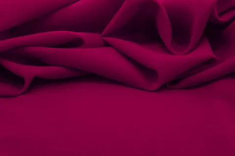 Texture of a smooth luxurious, elegant fabric in pink, purple, red. Purple .. Stock Photos