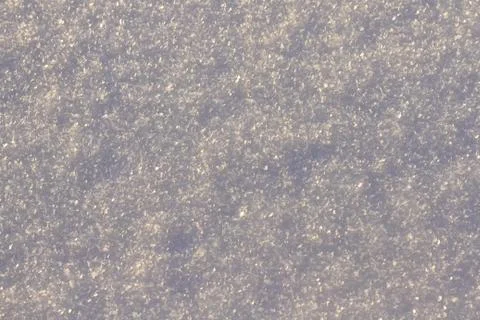 Texture of snow glitters in sun pattern. Christmas, new year, morning before Stock Photos