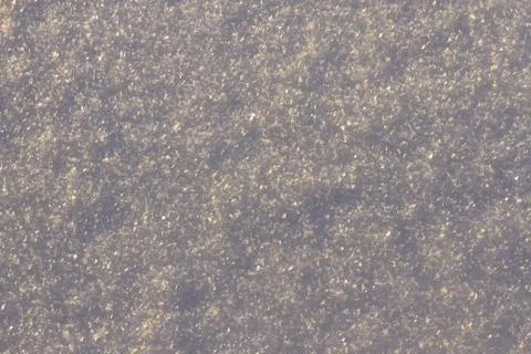 Texture of snow glitters in sun pattern. Christmas, new year, morning before Stock Photos