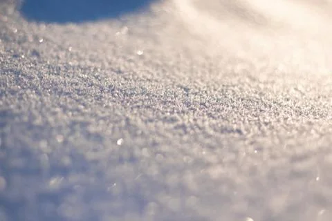 Texture of snow glitters in sun pattern. Christmas, new year, morning before Stock Photos