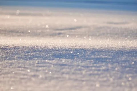 Texture of snow glitters in sun pattern. Christmas, new year, morning before Stock Photos