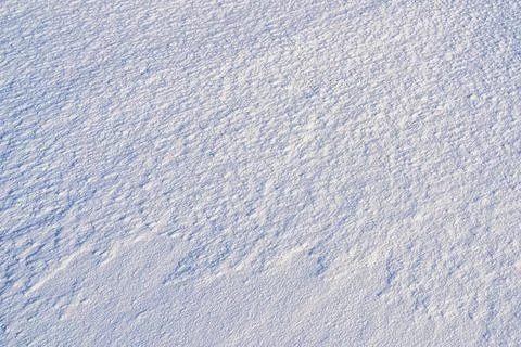 Texture of snow illuminated by sunlight. 스톡 사진