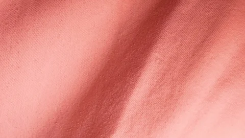 Texture of soft fabric made of cotton and polyester coral color. Stock Footage 101354416