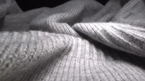 The texture of a soft warm cozy gray woolen knitted sweater Stock Footage 167069178