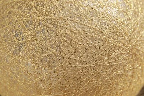 Texture of sphere made with golden threads, closeup Stock Photos