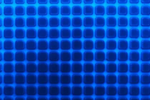 Texture with square elements of blue. Plastic candy lining Stock Photos