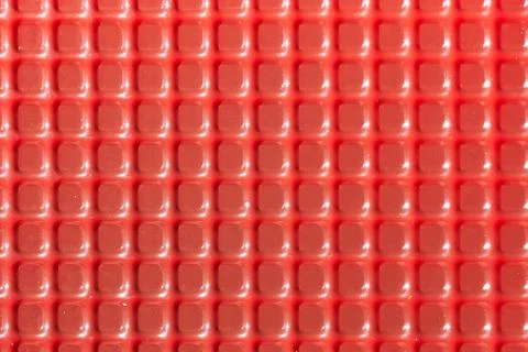 Texture with square red elements. Plastic candy lining Stock Photos