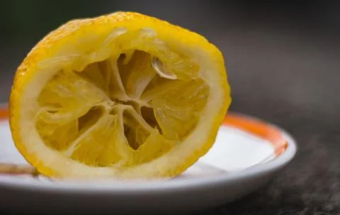 Texture of squeezed lemon cut in half, close up. Fotos Stock