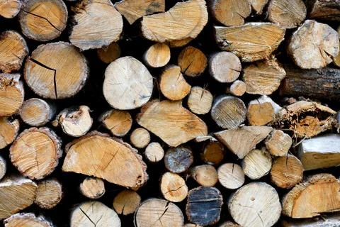 The texture of a stack of chopped firewood, close-up. Stock Photos