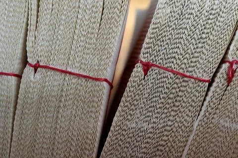 Texture of Stacked Paper Edges Bound with Red String Fotos Stock