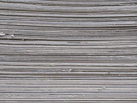 Texture of stacked thick and rough paperboard or cardboard for background Stock Photos