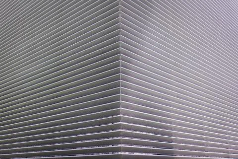 Texture of steel ventilation grille on the wall of a building Stock Photos