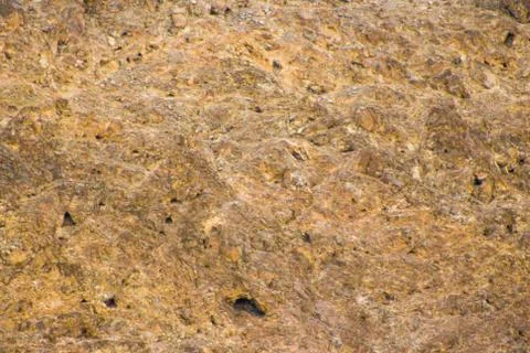 Texture of stone background close-up part of the wall of natural stone lined Stock Photos