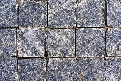 Texture of stone blocks. gray Stone background. Texture of a granite wall. .. Stock Photos