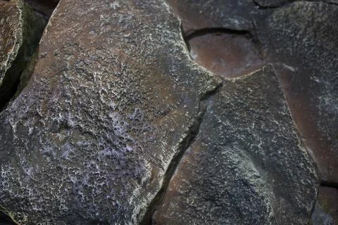 The texture of the stone is brown with large cracks Stock Photos