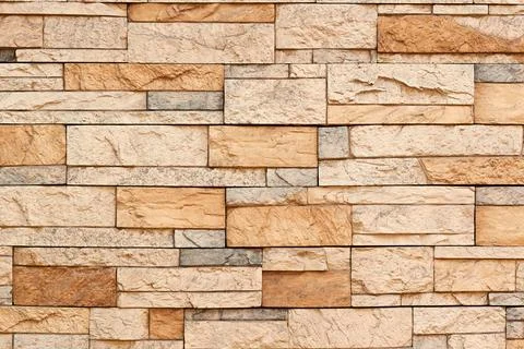 Texture of stone. Masonry. Decorative facing of facades, walls. Stock Photos