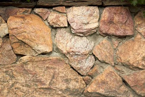 Texture of stone. Masonry. Decorative facing of facades, walls. Stock Photos