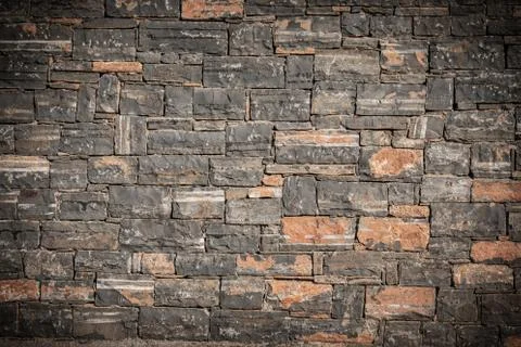 Texture of a stone. Old stone wall texture background. Grey stone wall as a b Stock Photos