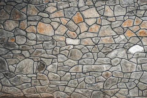 Texture of a stone. Old stone wall texture background. Grey stone wall as a b Stock Photos