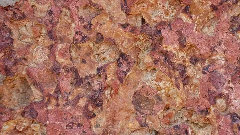 The texture of the stone is red orange, brick, background material Stock Photos