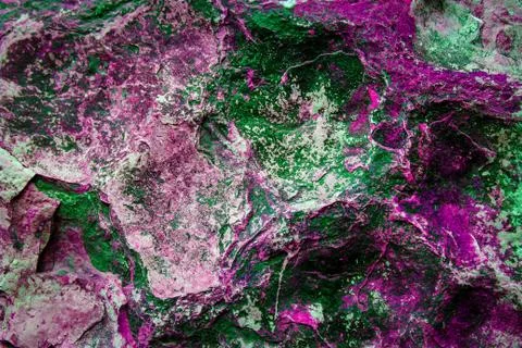 The texture of a stone surface with green and raspberry color oxide Stock Photos